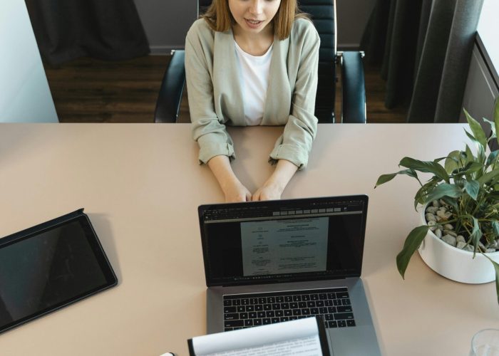 High-angle view of a job interview in a modern office setting, capturing professionalism.